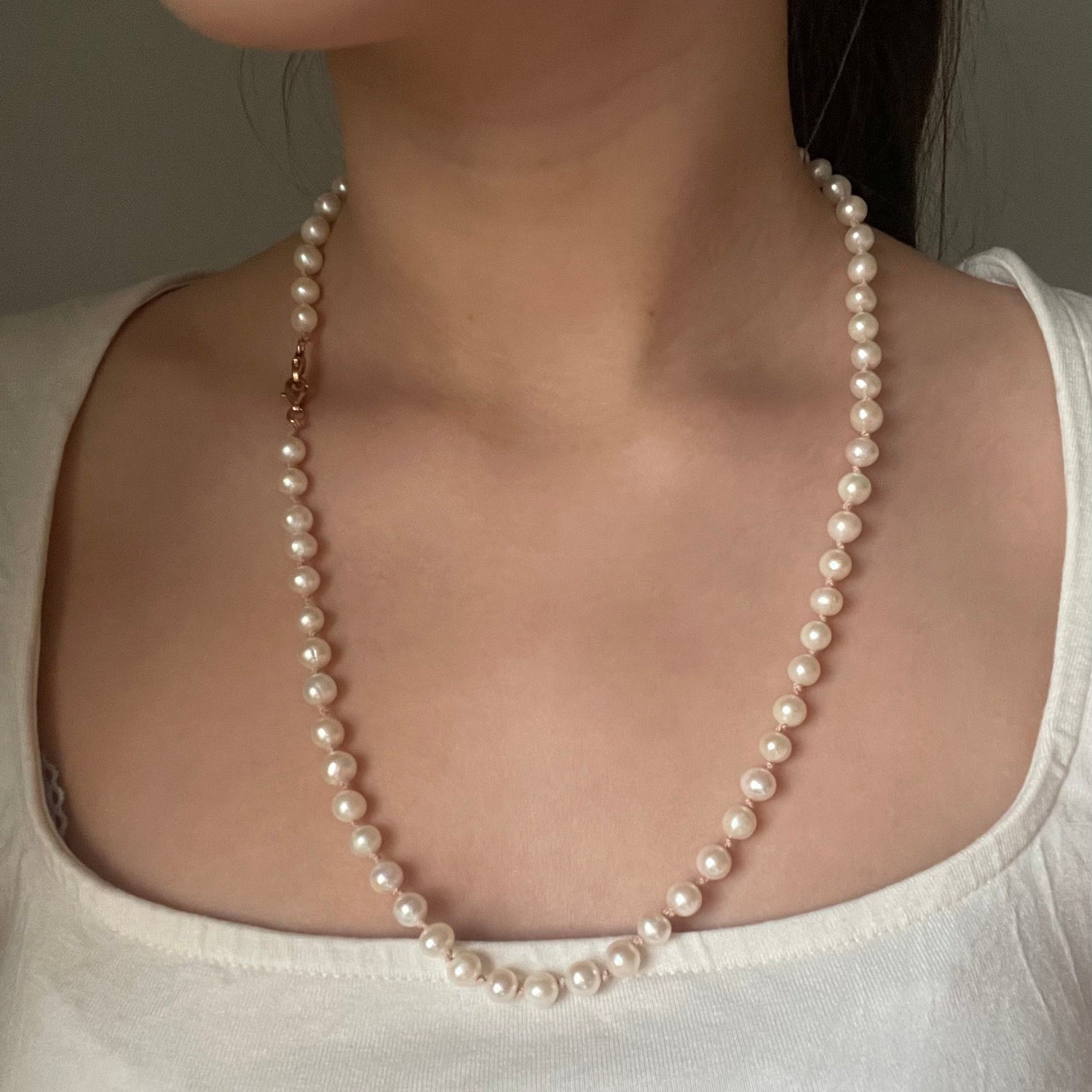 Hand-noted in Sweden,freshwater pearl necklace,with 100% silk thread,18k rose gold plated sterling silver double lock.vanilla color.length 55cm